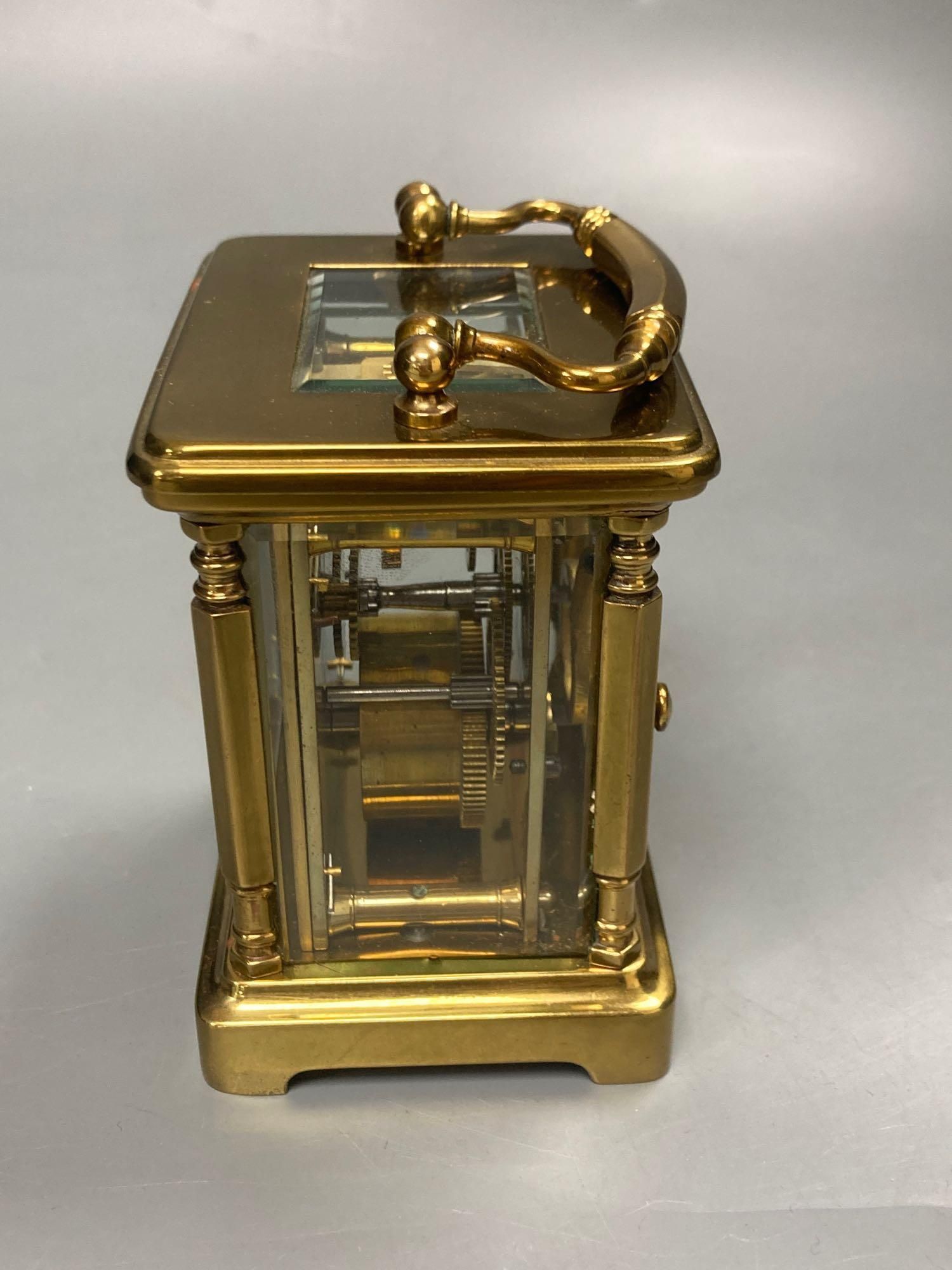 A late 19th century French brass carriage timepiece, 13cm high to handle